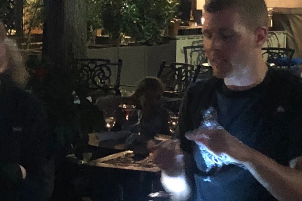 Tour guide telling ghost stories in front of The Occidental Grill