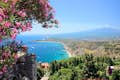 Baia i Naxos with views of Mount Etna