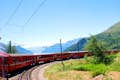 Moritz et les Alpes suisses avec le train rouge de la Bernina au départ de Milan