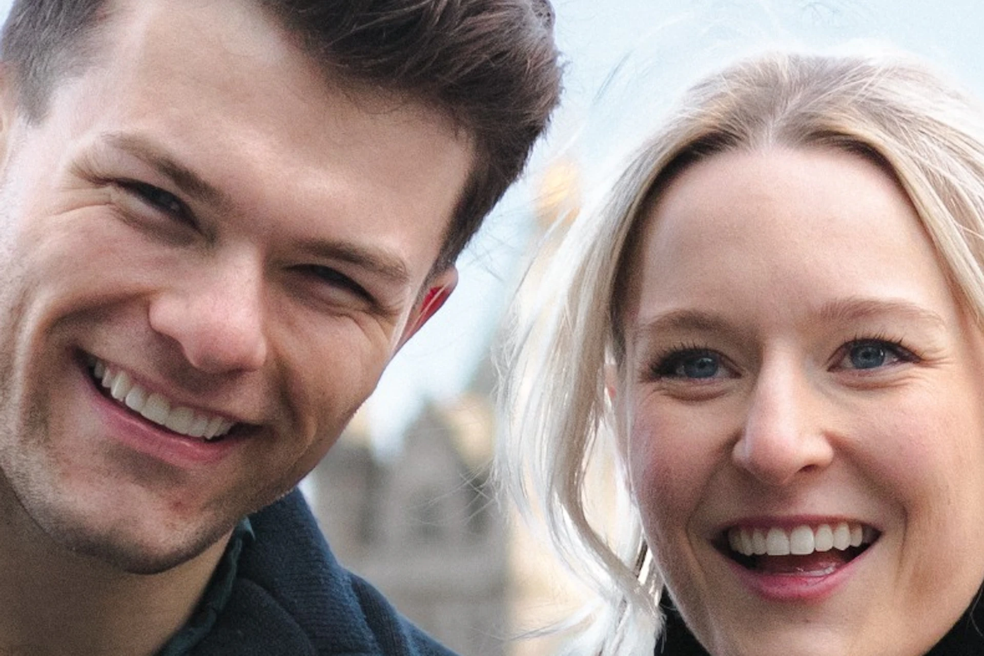 A couple enjoying their photoshoot in front of the iconic Tower Bridge