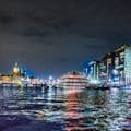 Enjoy the beautiful Open harbor of Amsterdam at night!