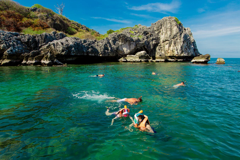 Set off to the pristine "Koh Wow" for snorkeling in crystal-clear waters.
