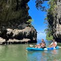 Continue paddling your kayak and you'll find a narrow channel that changes from mangrove forest to limestone mountains, passi