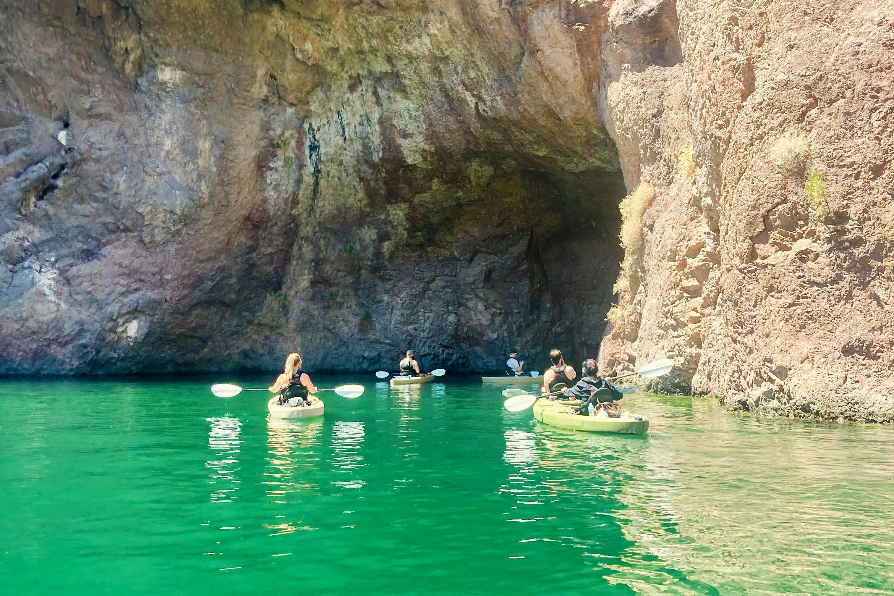 Kayakers paddling into the Emerald Cave of the Black Canyon Narrows.