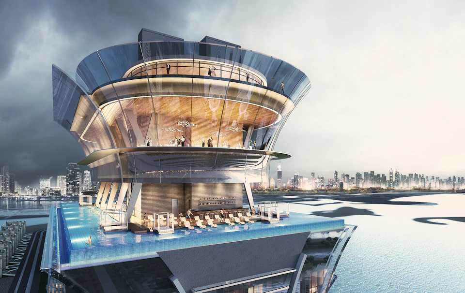 A modern, multi-tiered building with glass walls features an elevated swimming pool, lounge area, and people enjoying the view.