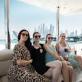 ladies enjoying cruise and sitting on aft deck leather sofa