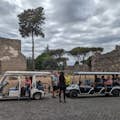 Golf cart in front of Cecilia Metella's tomb