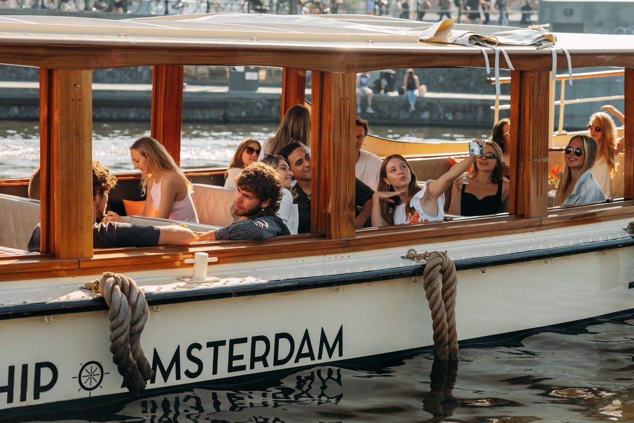 Classic Amsterdam saloon boat on the water during Sail Amsterdam.