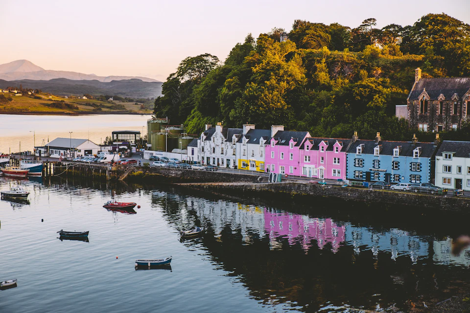 Portree: The beautiful pastel buildings being reflected in the Sea of the Hebrides.