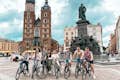 A fun group enjoying our bike tour at the Main Market of Krakow.