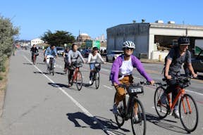 A group of friends ride through San Francisco