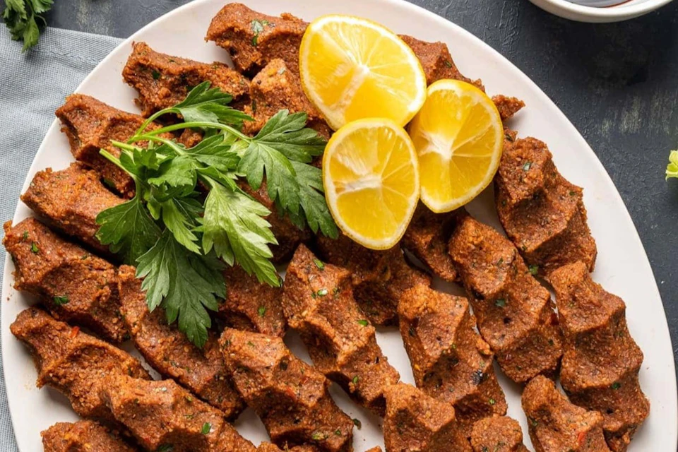 The iconic ciy köfte combines bulgur, walnuts, and many special Turkish spices topped with herbs! So yum!