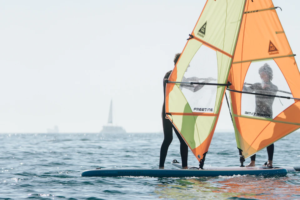 People practicing windsurfing