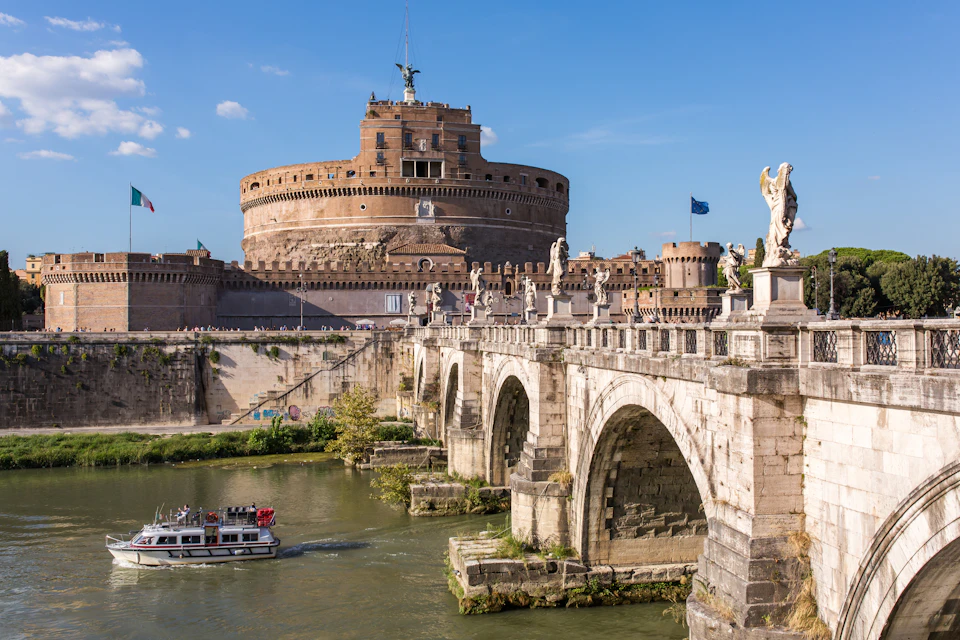boat passing under sant'angelo bridge