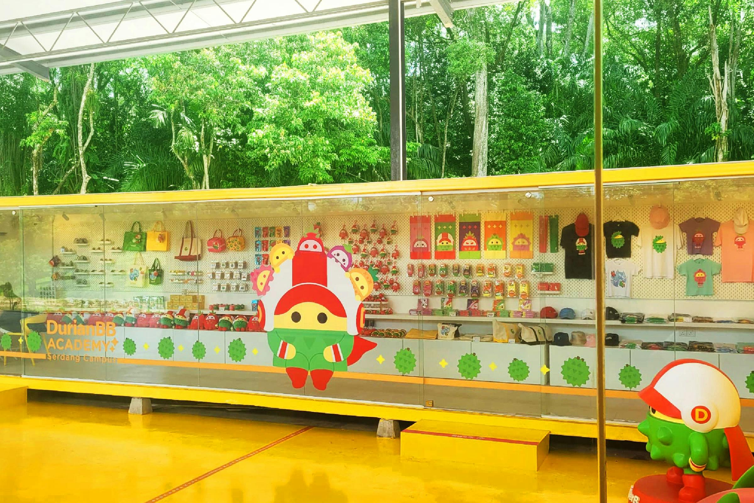 A brightly colored shop display featuring cartoon character merchandise, with a forest visible in the background.