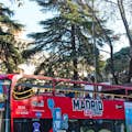 Double decker bus Madrid city tour with tourists on the open top deck sightseeing