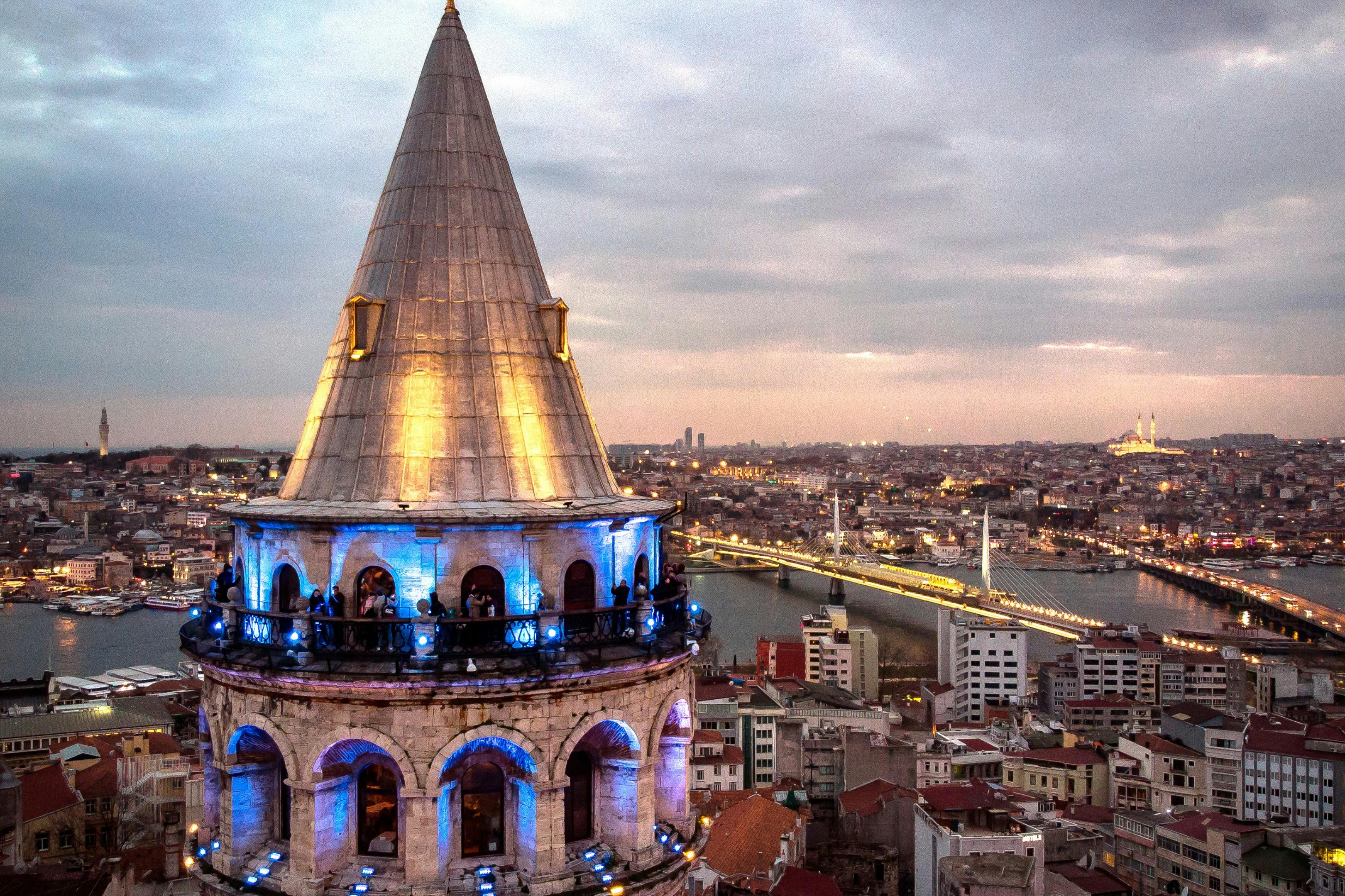 Galata Tower in the evening with cool lighting.