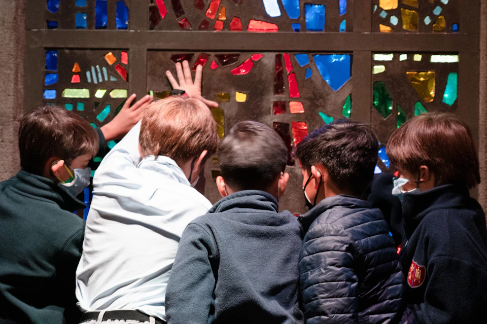 Touching a stained glass window by Gabriel Loire