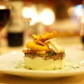 Oxtail timbale with crispy vegetables on a base of mashed potatoes from the Star Menu