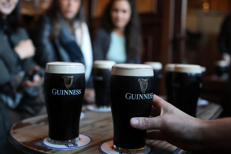 Perfect Pint Tour Patrons Enjoying A Pint Of Guinness