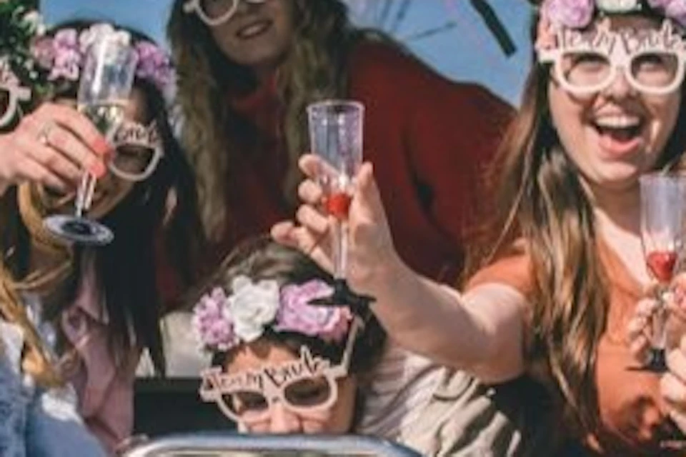 A group of women celebrating a bachelorette party on a modern yacht