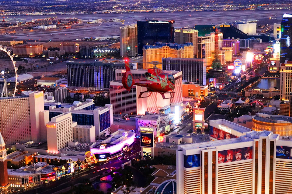 Helicopter flying over the vegas strip at night