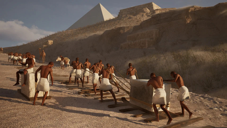 People in white cloths pulling a large stone block with ropes on wooden planks near pyramids.