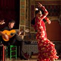 Flamenco dancer and musicians performing at Torres Bermejas in Madrid