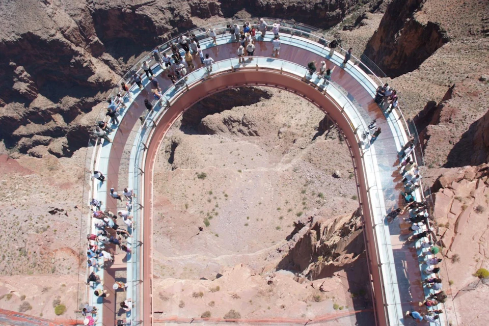 Walk the Sky on The Skywalk, suspended 2000 ft. above the floor of the Grand Canyon