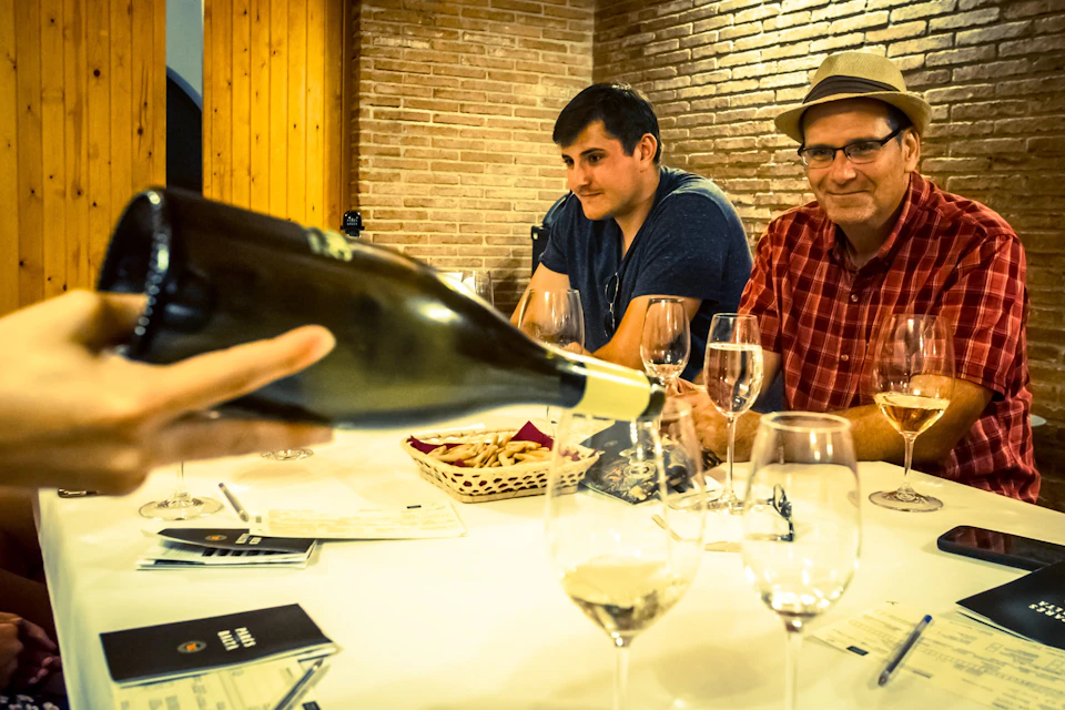 Enjoying a wine tasting on our Montserrat and Wine Tour.