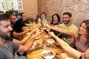 Group toasting to an amazing Kamikaze food tour, celebrating flavors and friendships.