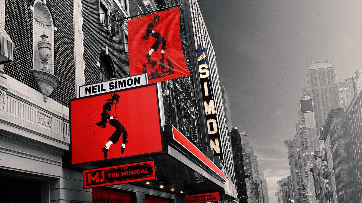 “Neil Simon”选框的剧院正面，展示以舞蹈剪影为特色的“MJ The Musical”海报和横幅。
