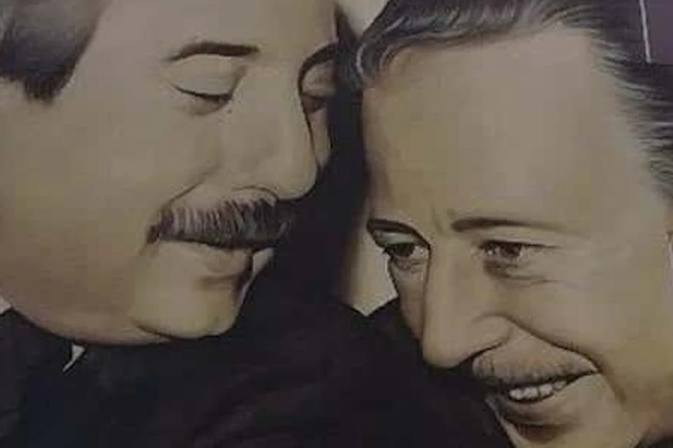 Two men with mustaches, smiling, face each other closely in a mural that incorporates windows into the artwork.