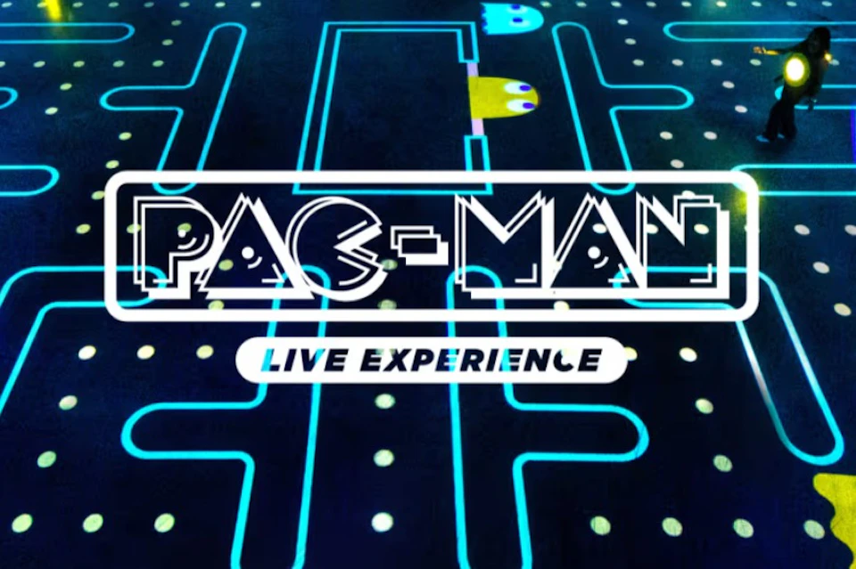 Neon-lit Pac-Man maze with characters Blinky and Inky, captioned "PAC-MAN Live Experience".