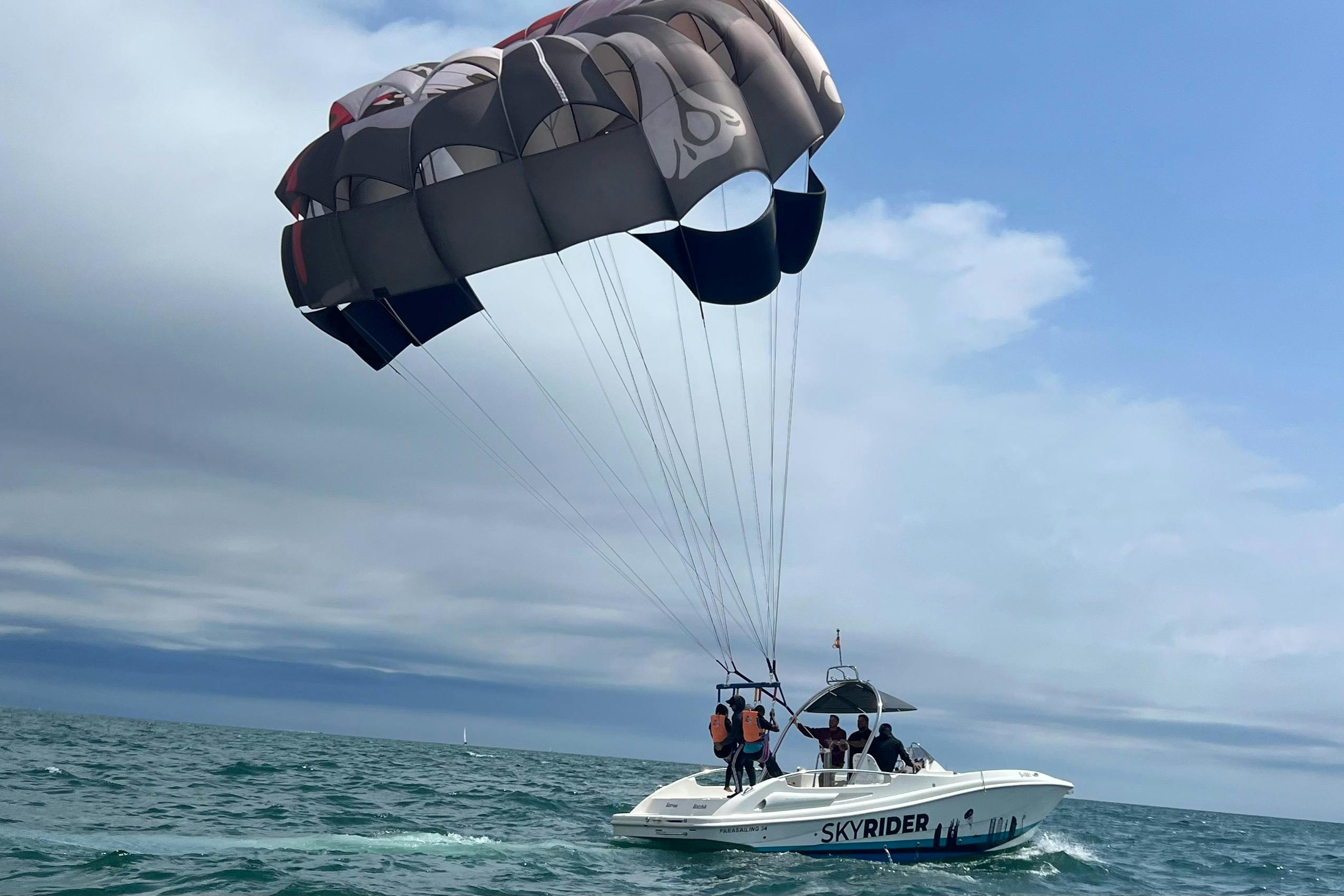 Parasailing boat with a parasail open, ready for take off