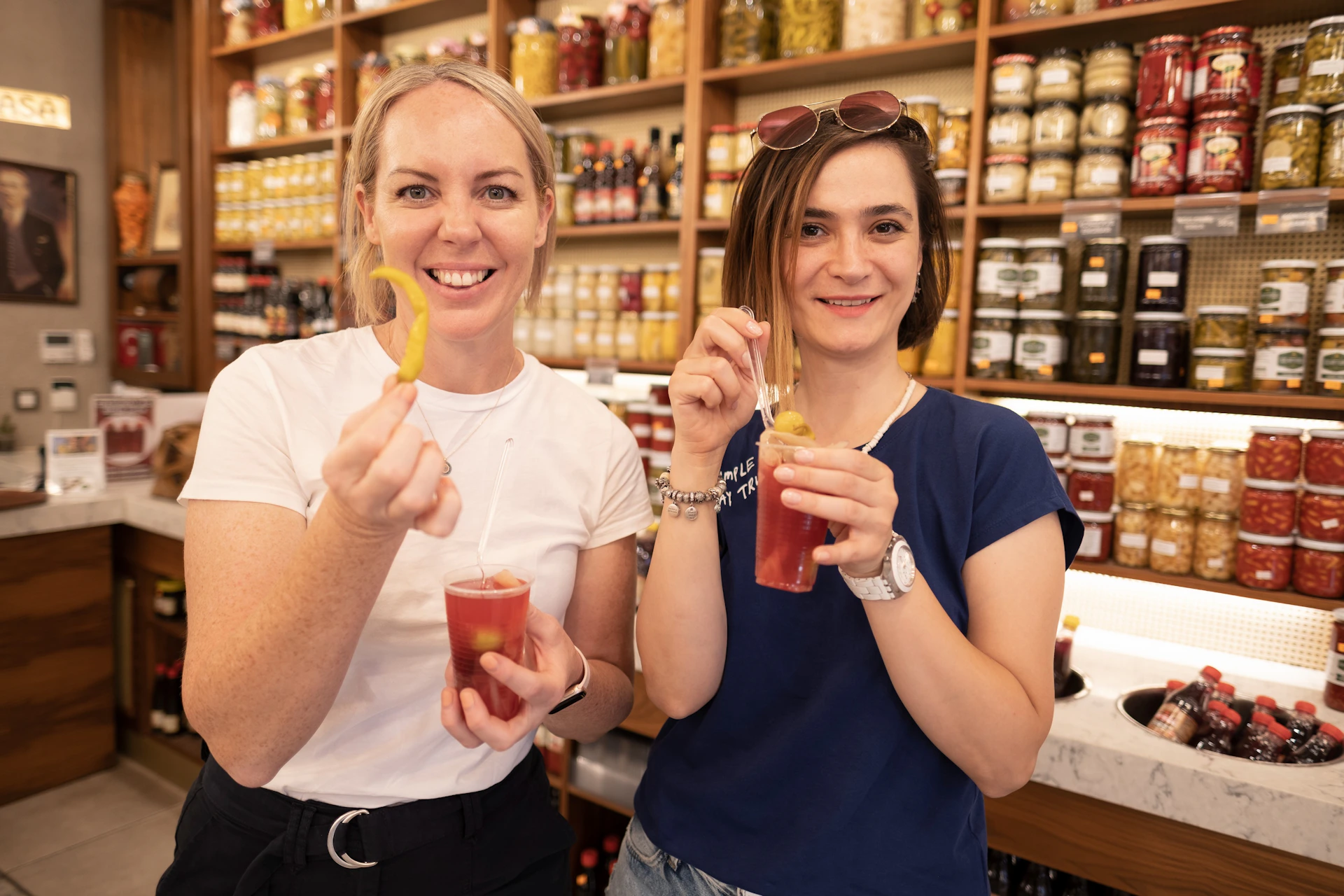 Foodie guests tasting food at a local food shop