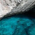 Crystal clear waters near the small caves, accessible only on board the Capri gozzi