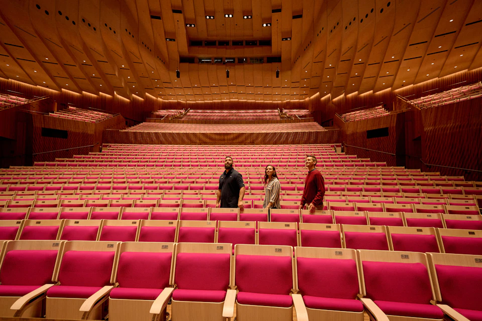 Visitors walking through Concert Hall.