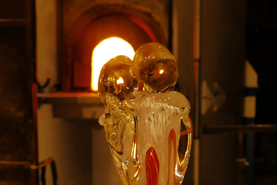 Image of a glass sculpture in front of the furnace