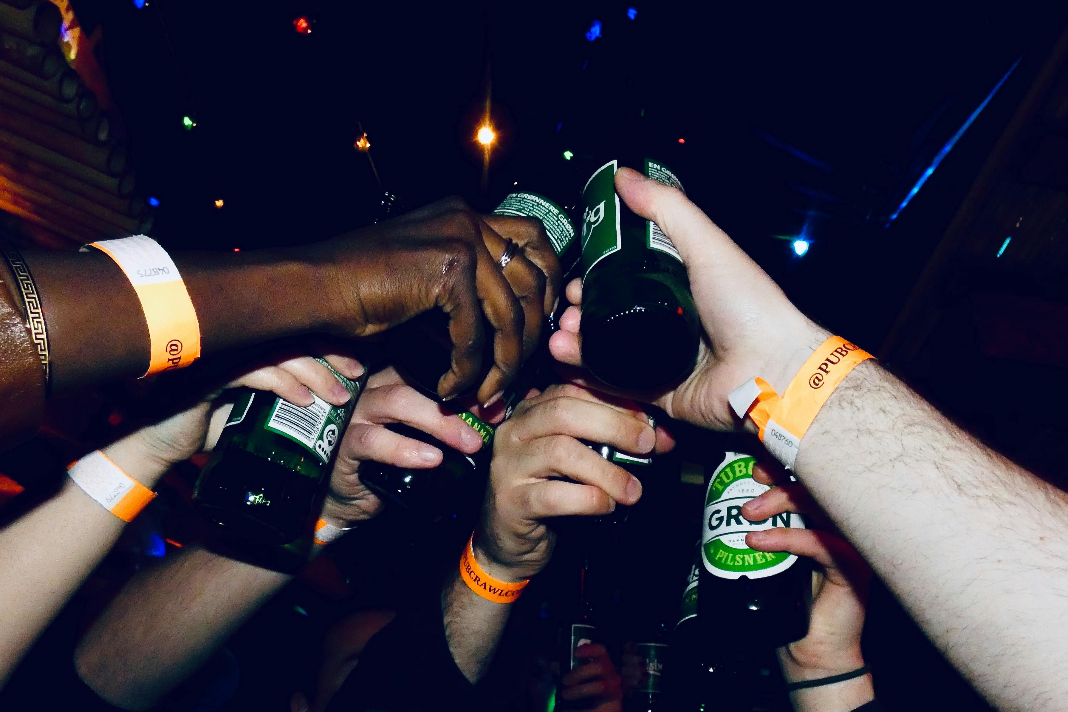 Cheers with bottles of beer