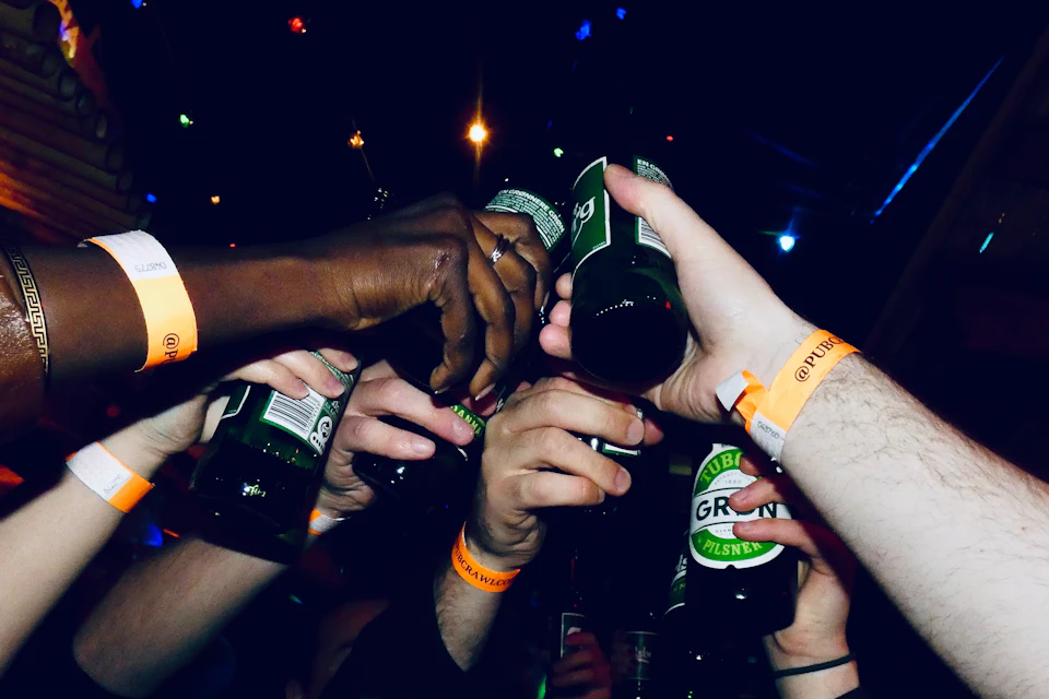 Cheers with bottles of beer
