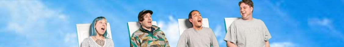 Four people, sitting in chairs against a bright blue sky, appear surprised or excited with wide open mouths.