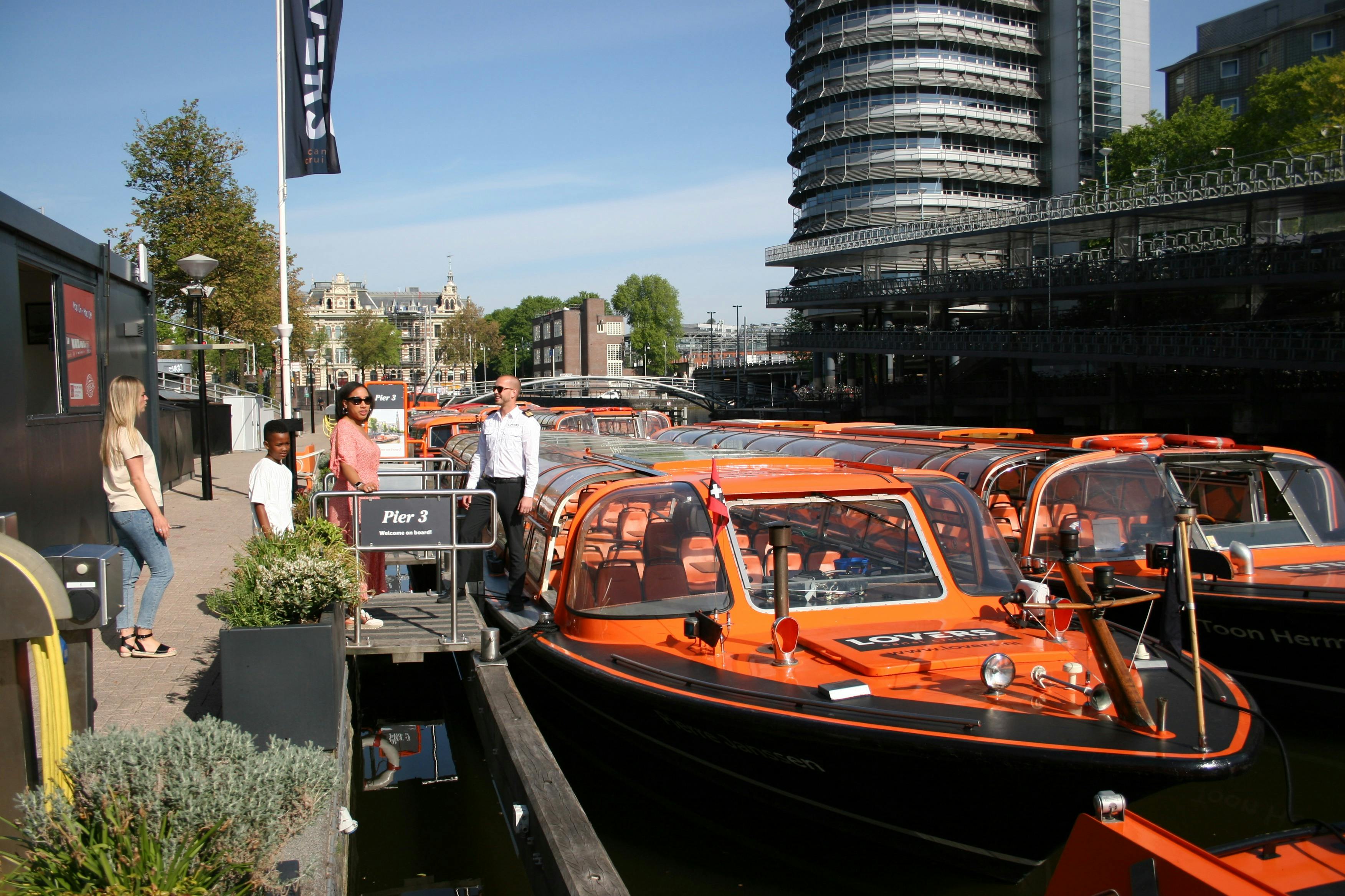 Lovers are cruising on a canal in a boat.