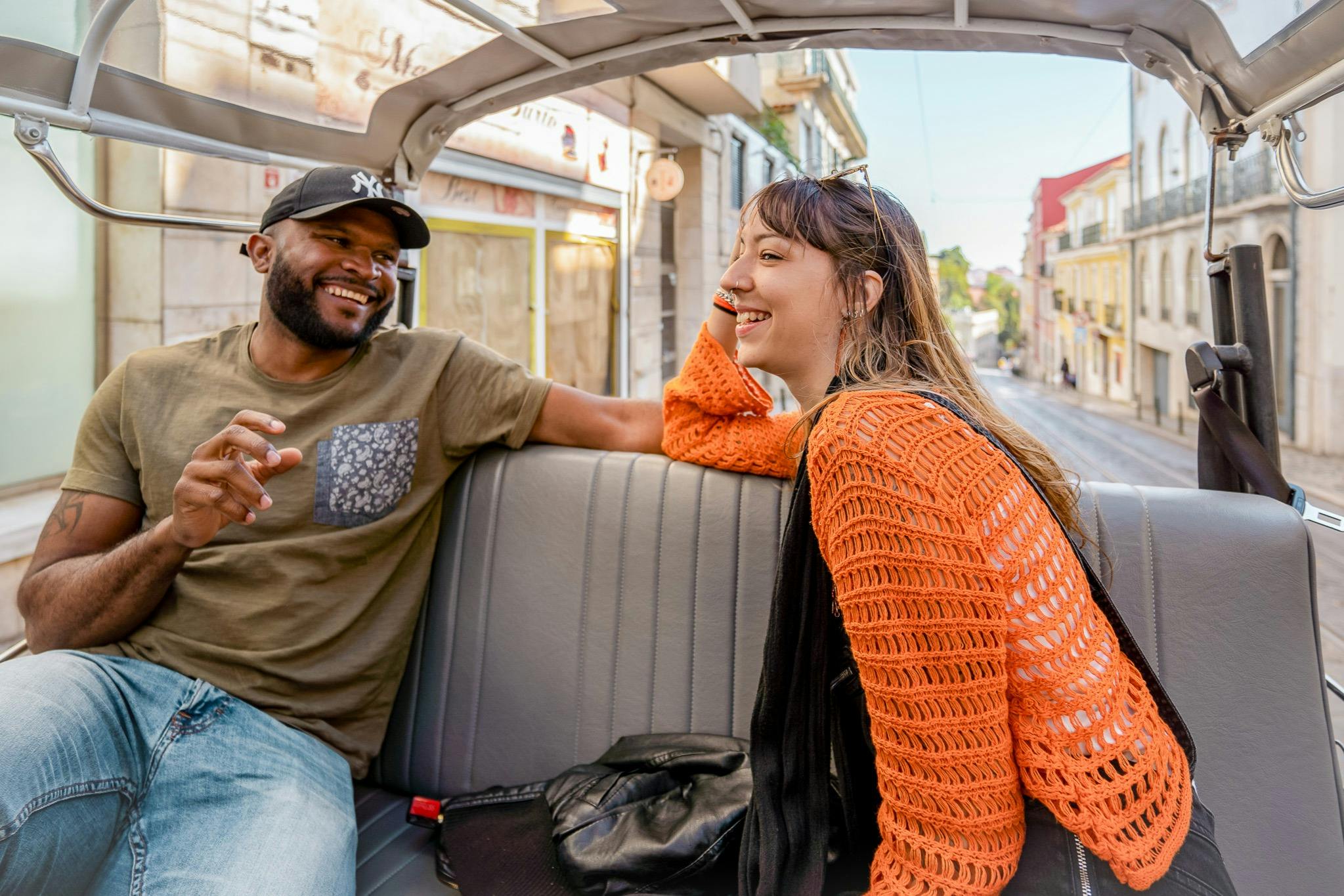 Tourists on a tuk tuk guided tour in Lisbon