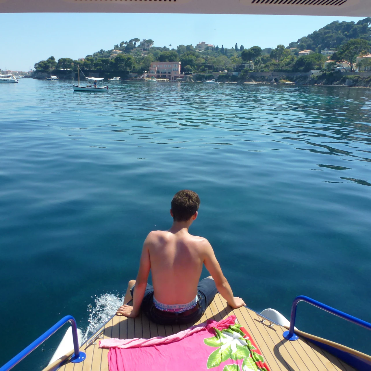 Sitting forward with feet in the water