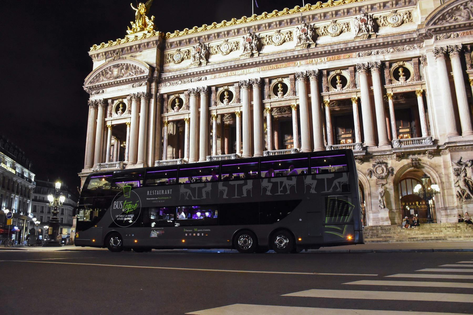 The Bus Toqué Champs-Elysées in front of the Paris Opera by night