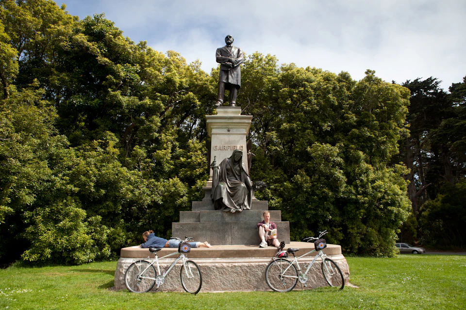 Taking a break by the statue in Golden Gate Park