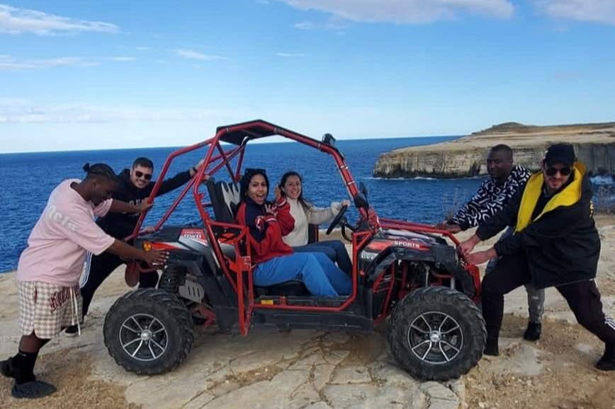 Friends posing next to one of their buggies