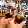 Tasting local drinks such as vermouth or beer.