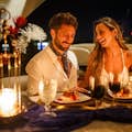 Happy couple enjoying dinner on luxury yacht